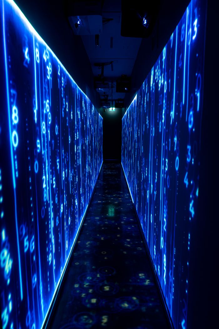 creative A luminous blue tunnel with digital numbers creating a futuristic, sci-fi ambiance.
